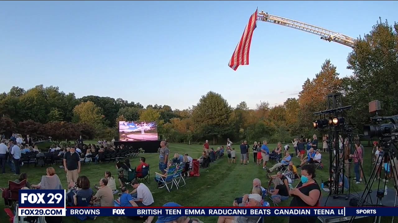 People gather at Garden of Reflection to mourn lives lost on 9/11