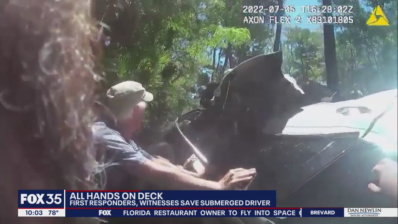 First responders, witnesses help flip submerged SUV