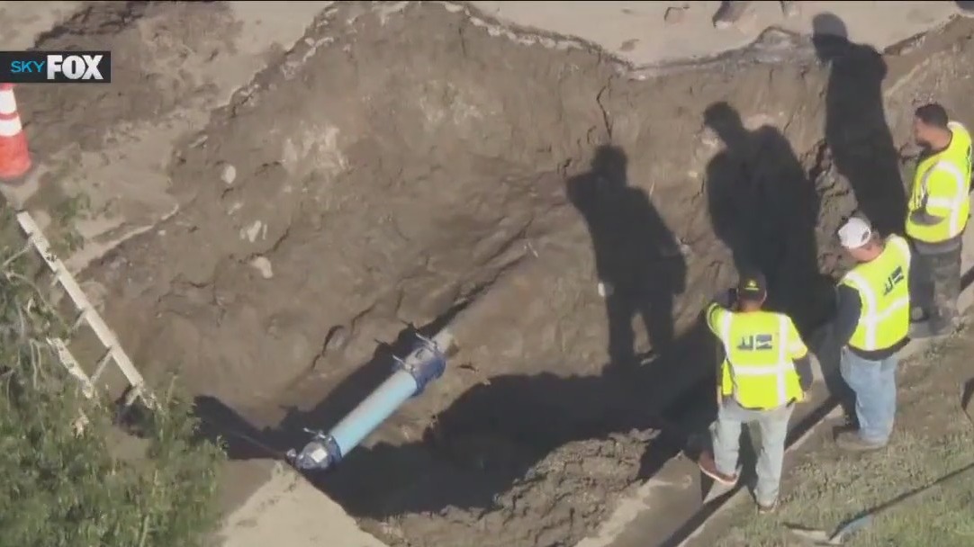 Riverside fire leads to street flooding, sinkhole
