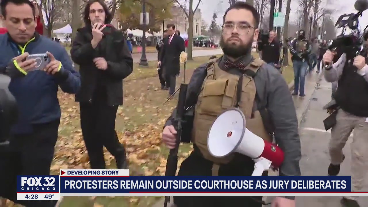 Man carrying AR-15 style rifle ushered away from Kenosha courthouse by police