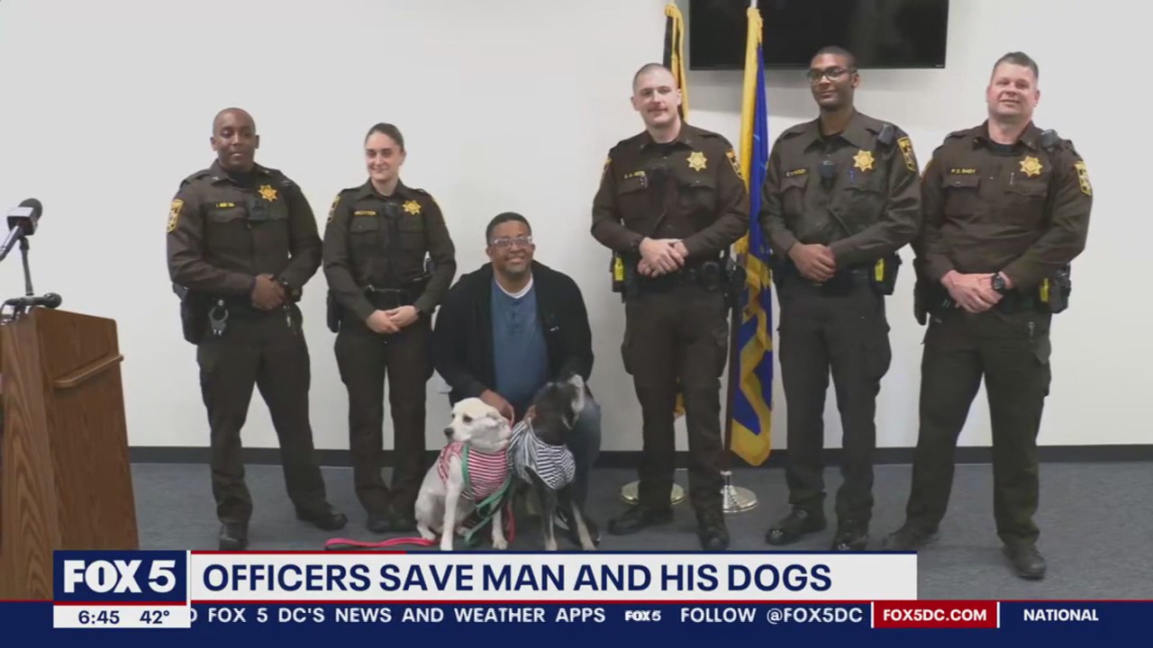 Waldorf police officers reunite with man, dogs they rescued from pond following car crash