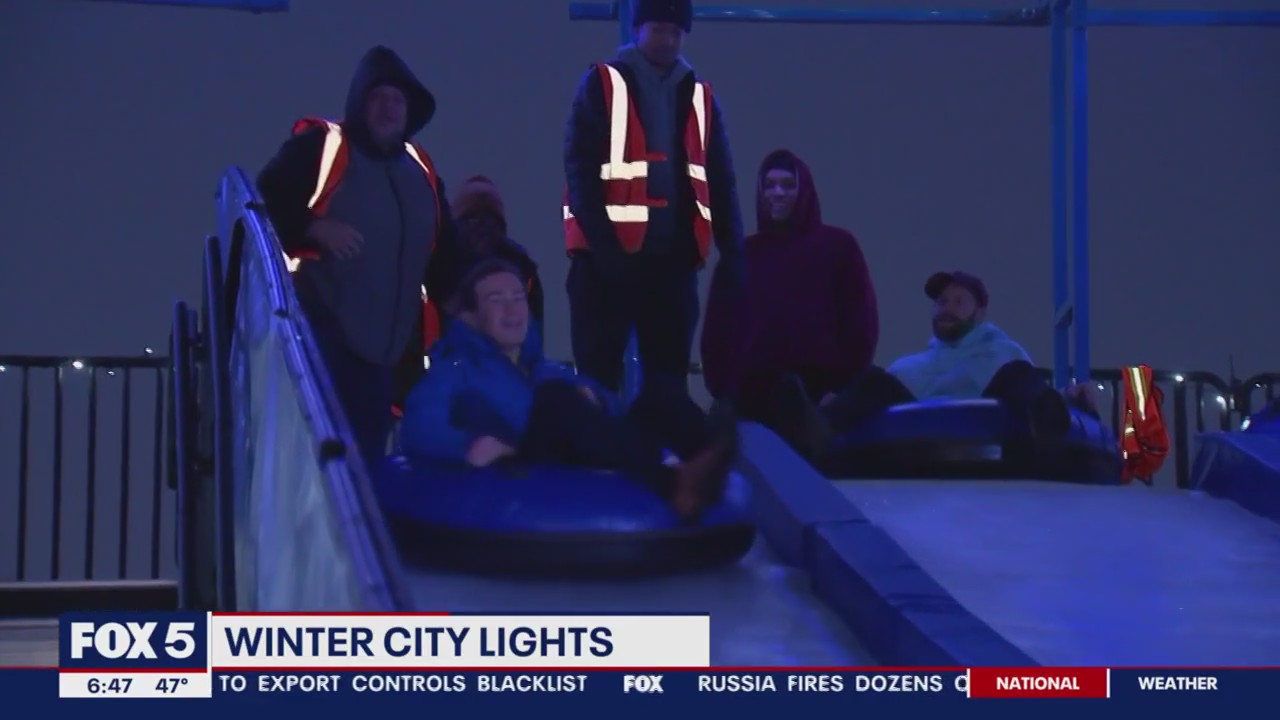 Riding the ice slide at Winter City Lights