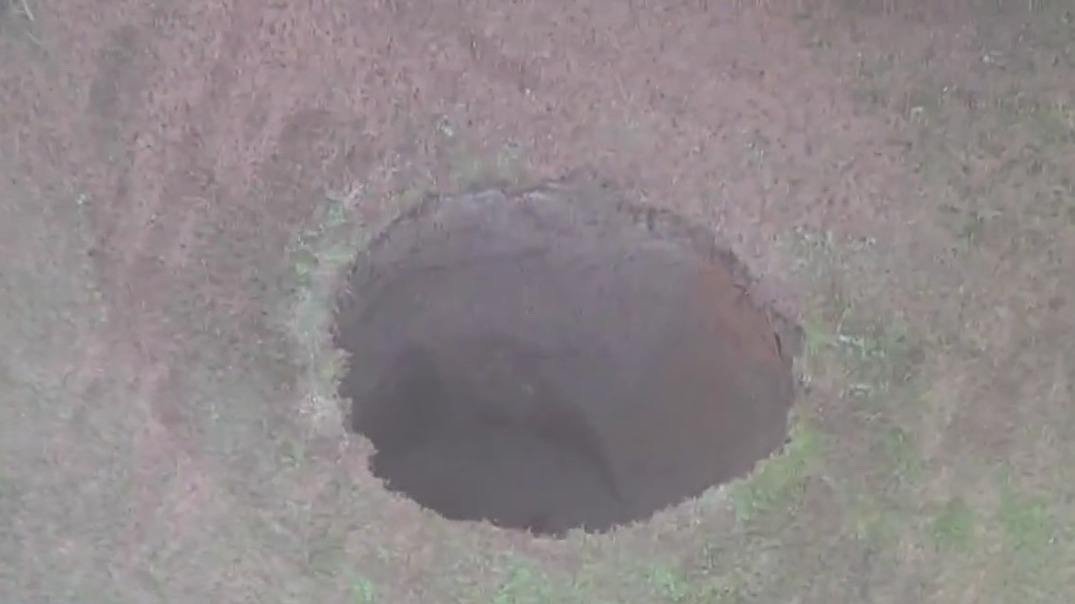 Sinkhole reopens at site of 2013 collapse