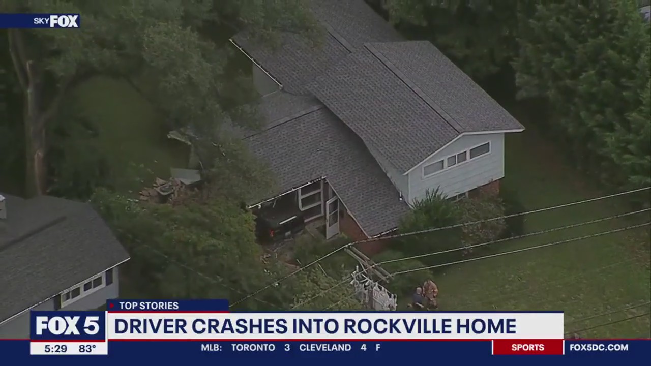 Vehicle crashes into Rockville home; downed power lines trap driver