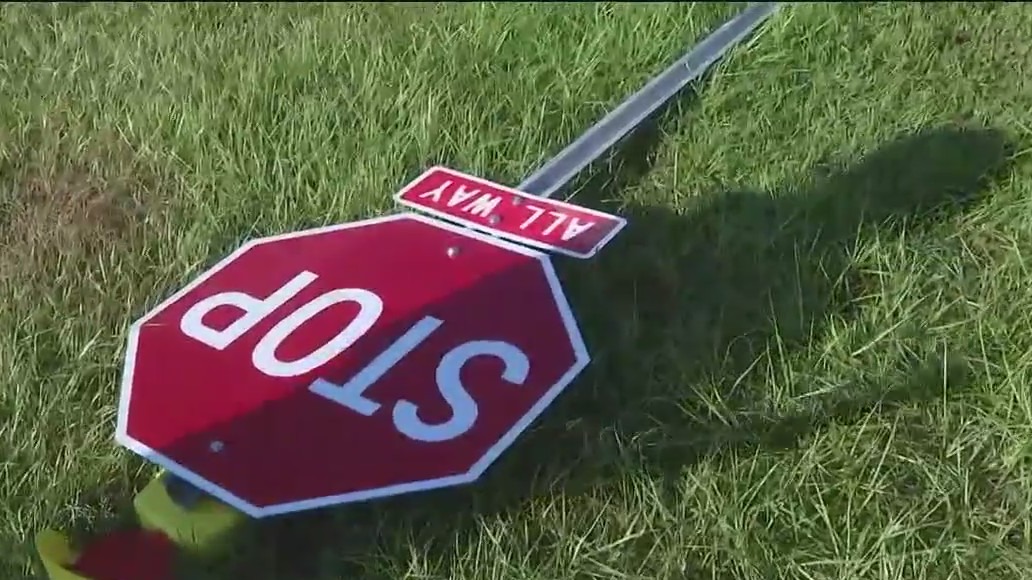 Installing new stop signs at deadly road