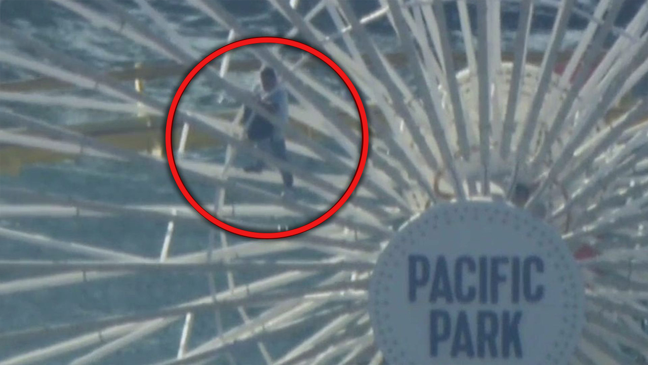 Man climbs on Santa Monica Ferris Wheel