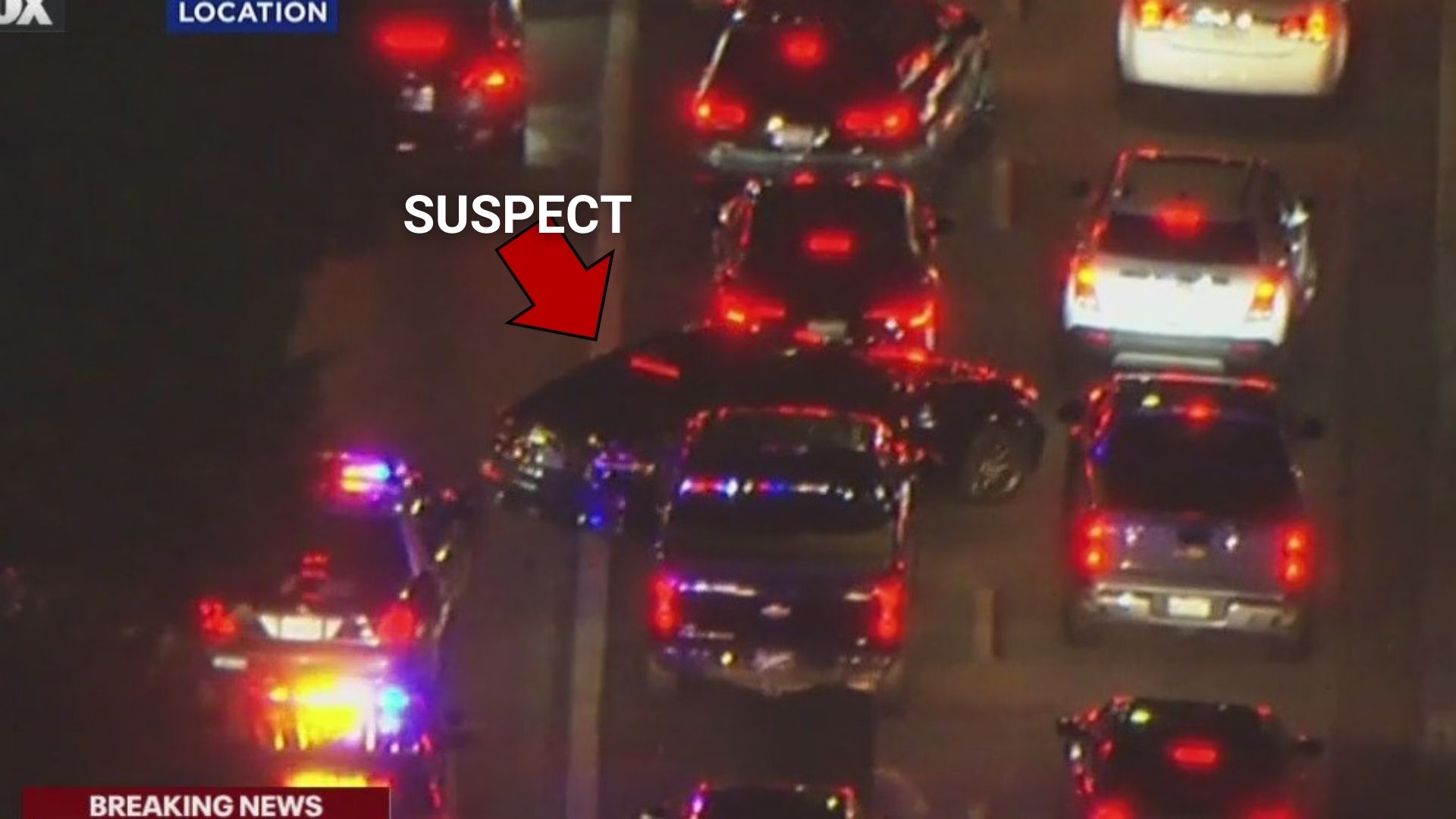 Pursuit suspect squeezes past tight traffic